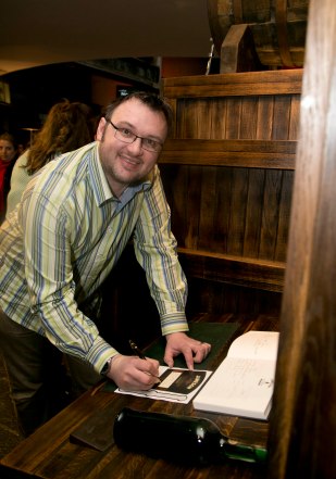 Stewart at Jameson, signing the ledger